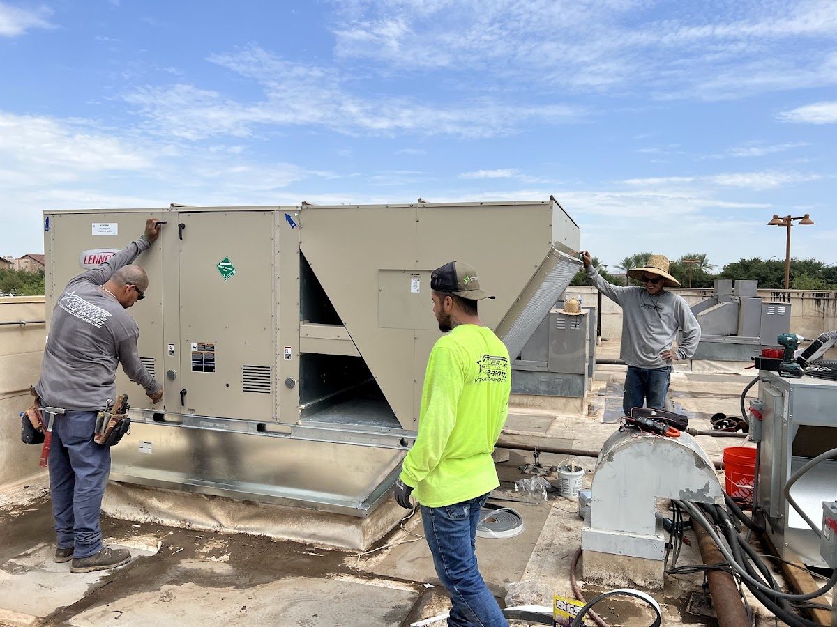 Crew installing a new HVAC unit